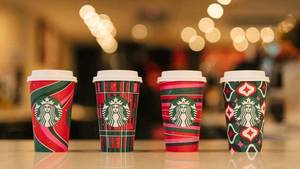 lot 6286 image: 1056 COUNT CASE 2023 Starbucks 12 fl oz Holiday Paper Cups, 4 Styles - Party Plaid, Peppermint Swirl, Ribbon Spool, Bauble Wrap