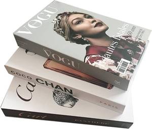 lot 8868 image: Set of 3 Fashion Designer Decorative Book Boxes  Vogue, Tom Ford, & Coco Chanel Storage Props