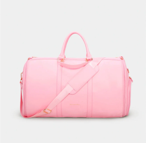 lot 2068 image: Beauty Goodies Pink Garment Travel Bag with Strap - Retail $45