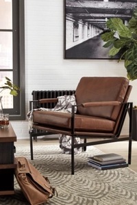 lot 2628 image: Retail $599.99 Puckman Leather Accent Chair