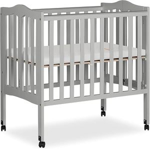 lot 22832 image: Dream On Me 2-in-1 Lightweight Folding Portable Stationary Side Crib in Pebble Grey, Greenguard Gold Certified, Baby Crib to Playpen, Folds Flat for Storage, Locking Wheels