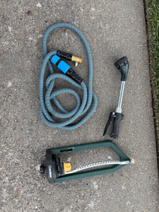 lot 25 image: Garden Hose, Spray Nozzle & Melnor Oscillating Sprinkler