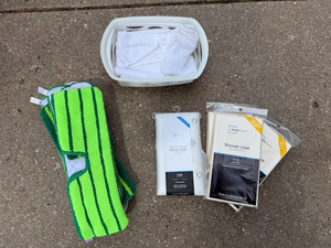 lot 67 image: Cleaning Supplies Lot with Mop Pads, Shower Liners & Towels