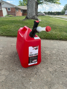 lot 75 image: Press N Pour 5 Gallon Gas Can