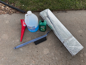 lot 76 image: Automotive Supplies Lot with Funnel, Fluids & Sunshade