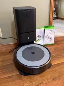 lot 146 image: iRobot Roomba Robot Vacuum with Clean Base Auto-Empty Dock & Accessories