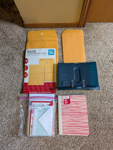 lot 215 image: Office Supply Lot  Clasp Envelopes, Greeting Cards, Notebook & Book Stand